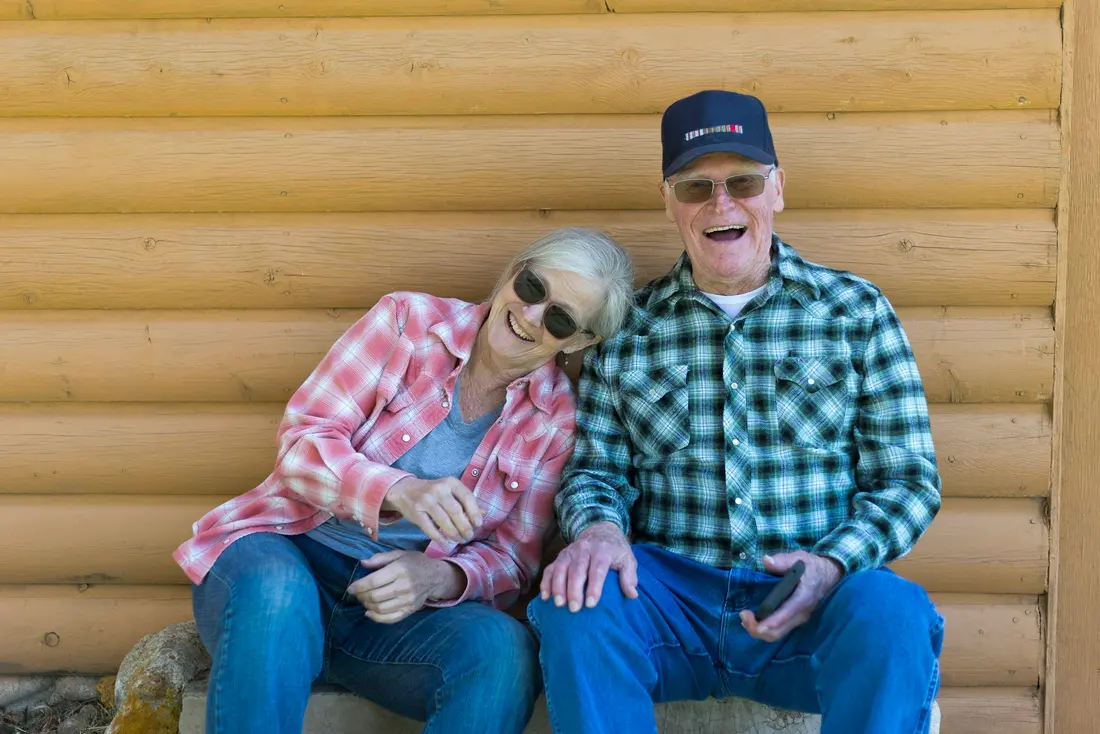 Older couple laughing together outdoors